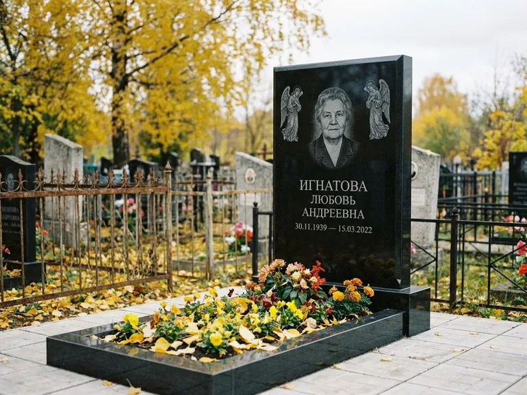 Памятник с гравировкой ангела — гравировка двух ангелов по сторонам портрета, работа «Игнатова» в Омске